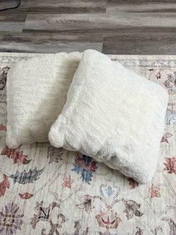 Set of white faux fur accent pillows (20x20)