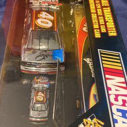 1:64 scale transporter with 1:24 & 164 scale stock cars & collector card