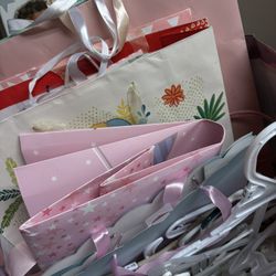 assortment of baby girl shower gifting bags