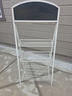 EXPENSIVE SHELF iron shelf for patio or clothing store chalk board on top.good condition
