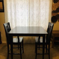 Dining table with 2 chairs from Basset Furniture