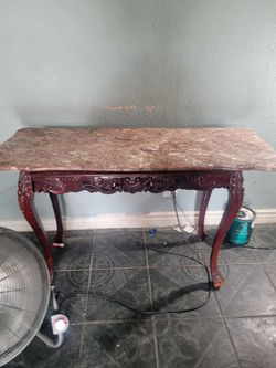 wooden tables with marble tops