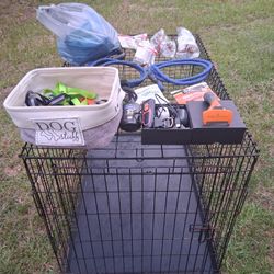 DOG KENNEL, SHOCK COLLAR, BARK  COLLAR, 2 LEASHES, 2 REGULAR COLLARS,  TREATS, PADS, & CARRYING BASKET