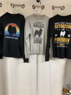 1 Black Pomeranian Rainbow Sweatshirt, 1 Black Pomeranian On Grey Sweatshirt, And 1 White Pomeranian On Black Sweatshirt.