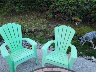 2 green plastic chairs