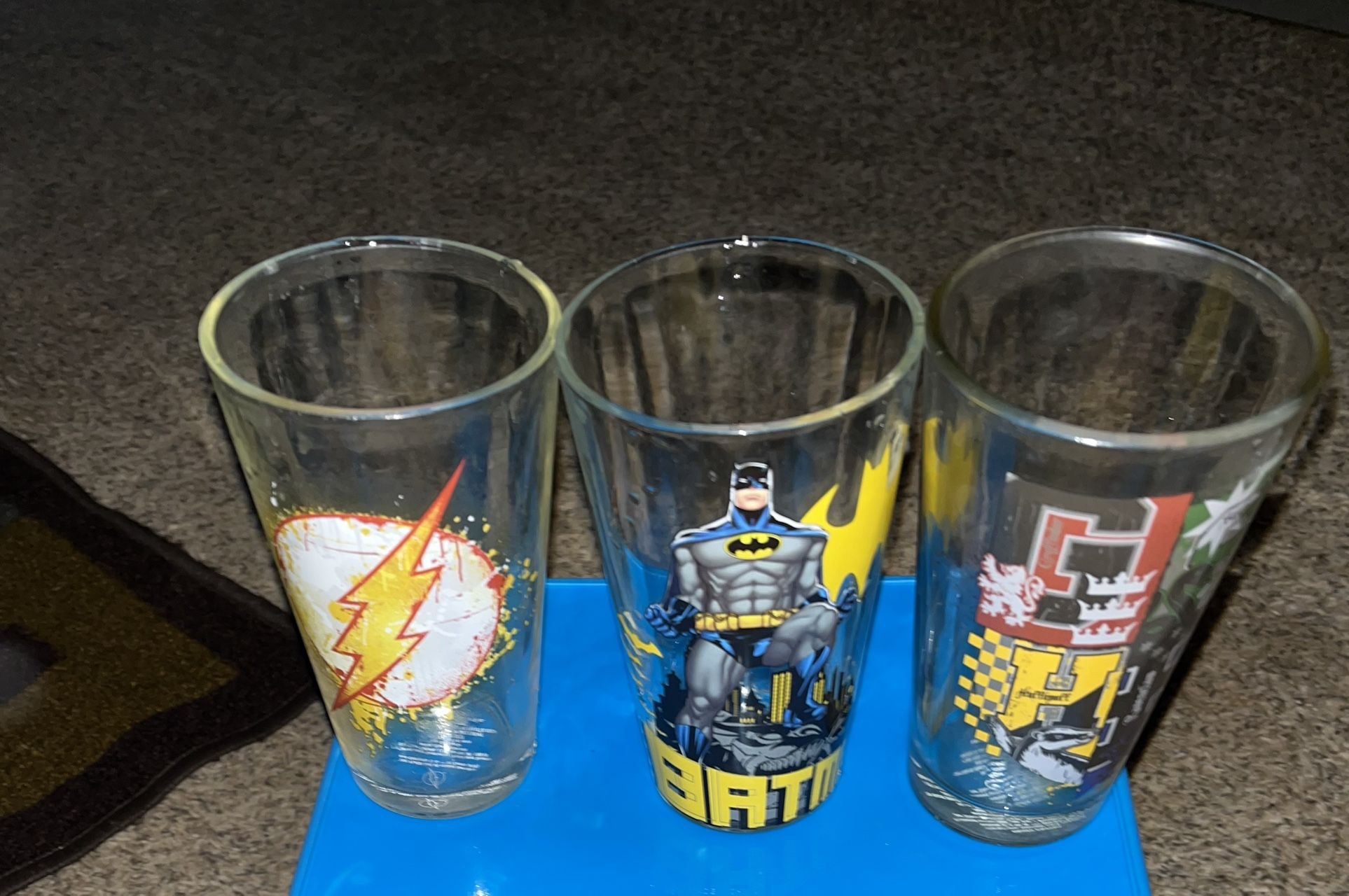 Used superhero/Harry Potter drinking glasses, all three for one price