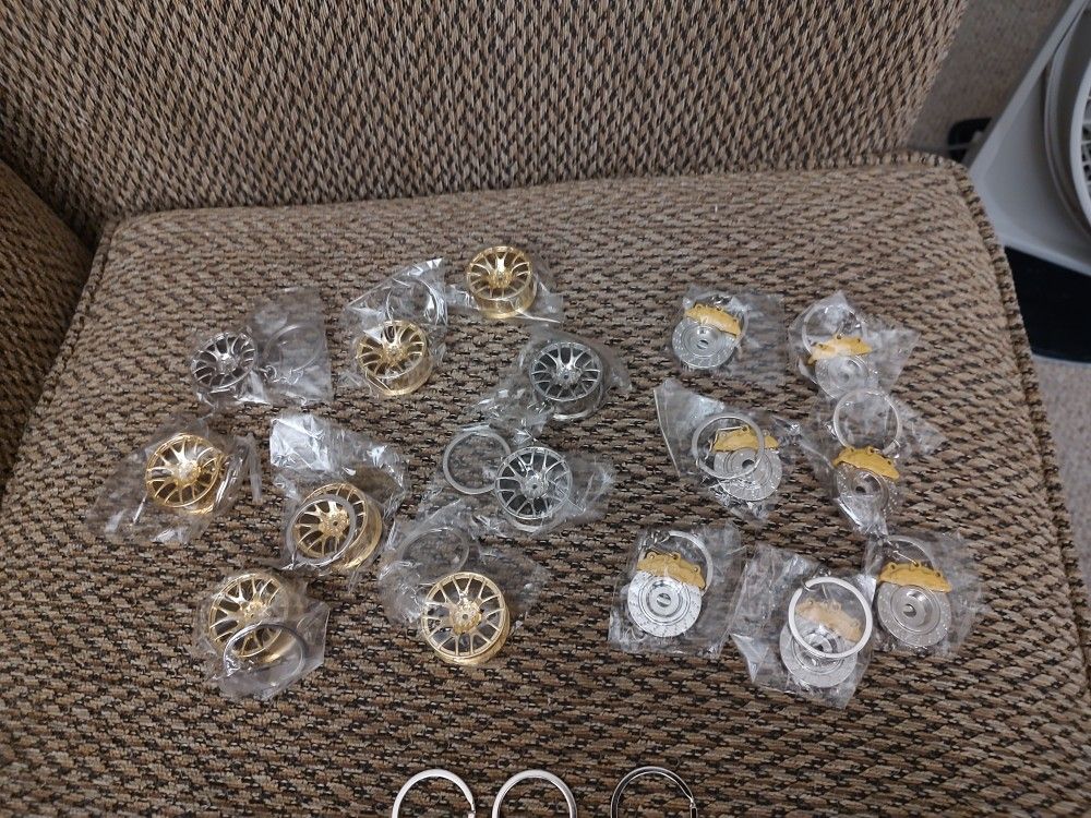 WHEEL AND BRAKE KEYCHAINS. $1 EACH. NEW. PICKUP ONLY.