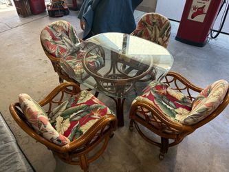 Mid century rattan  kitchen /dining room table and chairs, chairs are swivel with casters 42 in glass top good shape