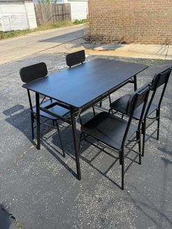TABLE AND 4 CHAIRS WITH 2 ADDITIONAL SIDE CHAIRS. $100.00 OR BEST OFFER.