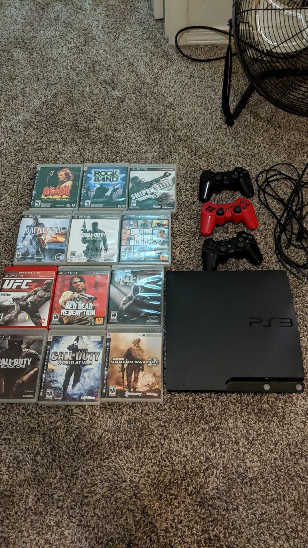 PlayStation 3 with games and controllers