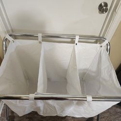 Metal laundry cart with wheels and three compartments