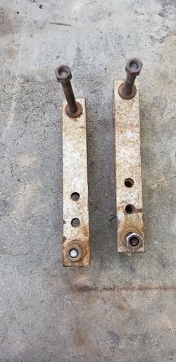 Leaf spring lift shackles.