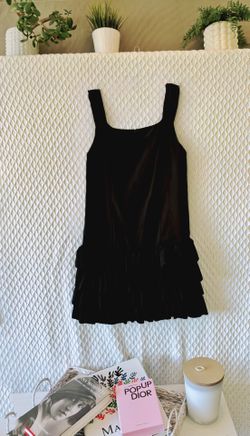 Size L dress (runs small), black with fringe at the hem. COST: $20.