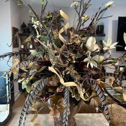 Large Faux Floral Design in Concrete Like Urn Substantial and elaborate Mix of faux flowers and natural elements in a stone look urn Magnolia flowers 
