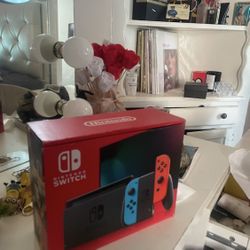 BRAND NEW Nintendo Switch with Neon Blue and Neon Red Joy-Con