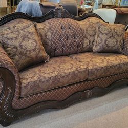 Euro Style Brown Sofa with Wood Trim