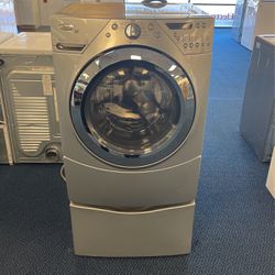 Silver Whirlpool Duet Front Load Washer on Pedestal