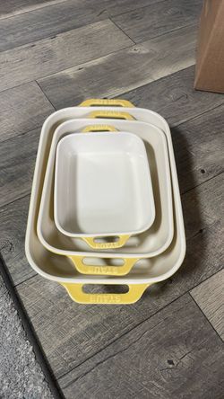 Three staub ceramic cooking dishes