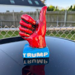 The Trump Thumbs Up Statue