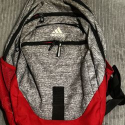 Adidas red and grey backpack