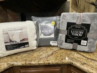 Four Piece King, set two pillowcases, one flat one fitted 78 x 81 waffle weave throw 50 x 71 oversize luxury grey throw 50 x 60
