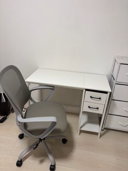 White desk with drawers and grey desk chair