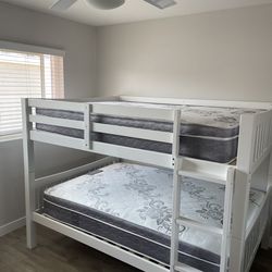 Full over Full bunk bed. Dark walnut,grey & white-$499. Full mattresses -$125.00 each. Assembly not included. Taxes included. Free delivery.  Se habla