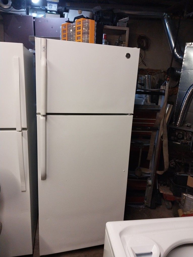 GE all white refrigerator. 28 inches wide 67 inches tall.