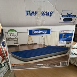 Air mattress with built in pump
