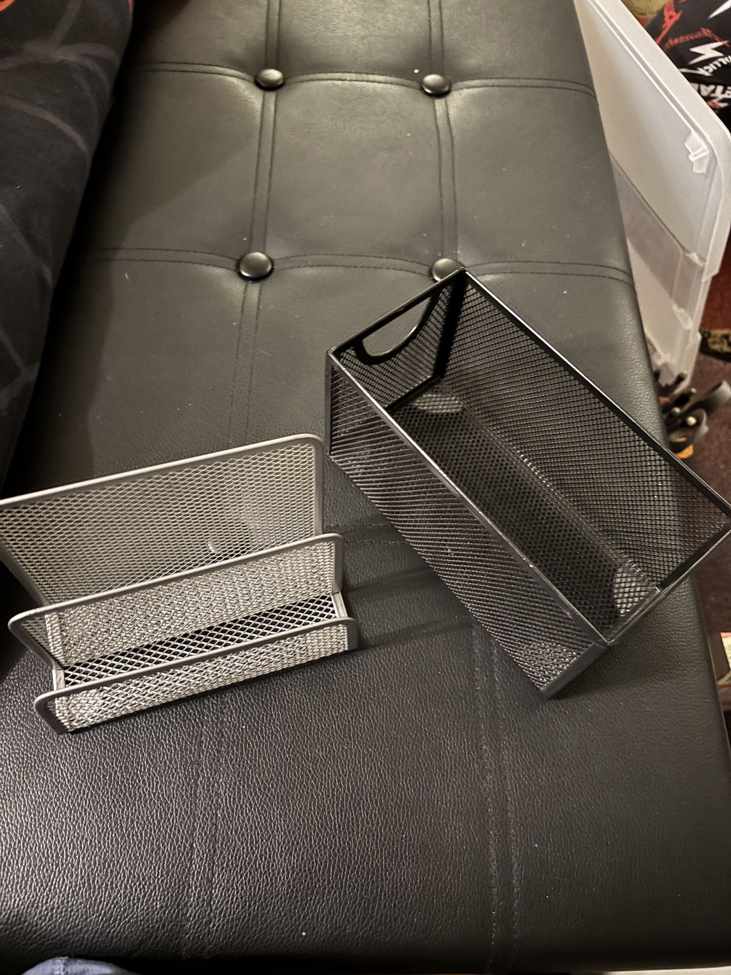 Two Mesh Holders, One Silver And One Black