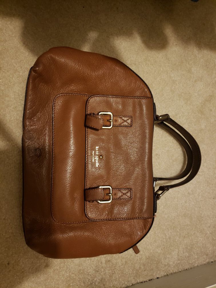 Tan kate spade purse small stain on bottom