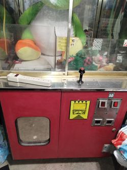 Claw machine and vending machine