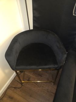 Black suede beauty chair with gold legs