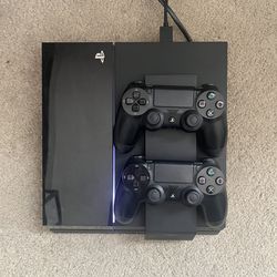 PS4 With Games And Controllers Charger