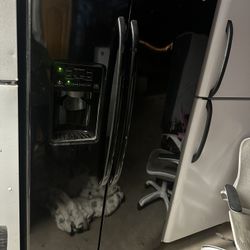 GE  shiny black side-by-side refrigerator Everything Works Can Deliver