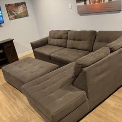 Gray sectional with Ottoman 