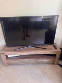 Samsung 55 Tv, Media Stand, Xbox, and dvds.