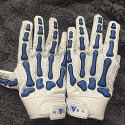 Rival white and blue skeleton gloves with blue bone-shaped pads
