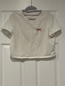 White crop top with red embroidered bow