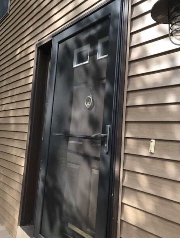 Aluminum storm and screen door