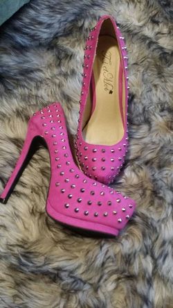 Fushia spike heels