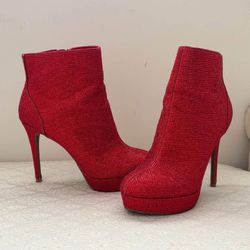 Ruby red high heeled boots