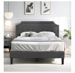 Full upholstered bed with tuffed headboard