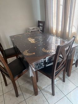 Table and 3 chairs with a bench chair