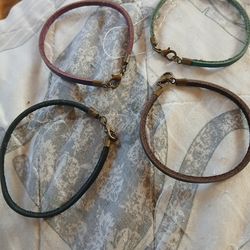 Four leather bracelets 5.00 firm