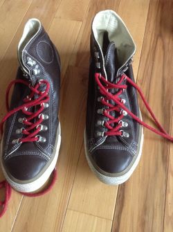 Brown leather converse