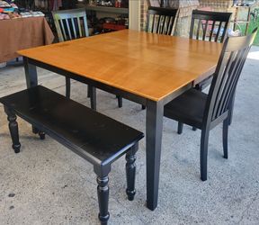 Table with 4 chairs and bench