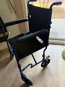Transport wheelchair