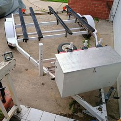 Large 2 jet ski trailer 8 feet wide and 24 feet long. With gear box.795$