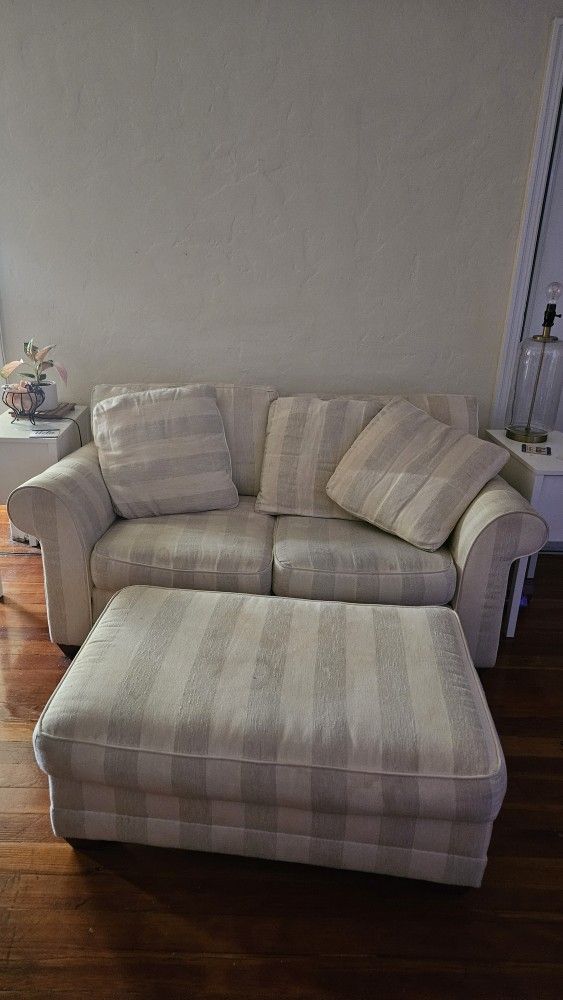 beige striped loveseat with ottoman